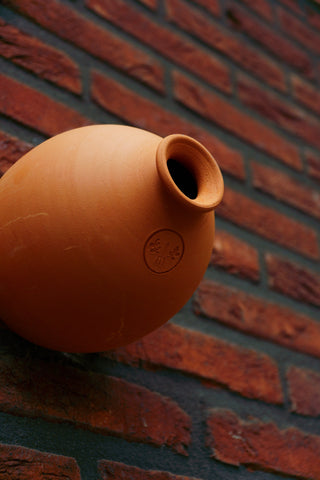 Casa para pájaros de terracota