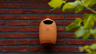 Casa para pájaros de terracota